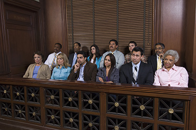 Group of multiethnic business people sitting together in court room